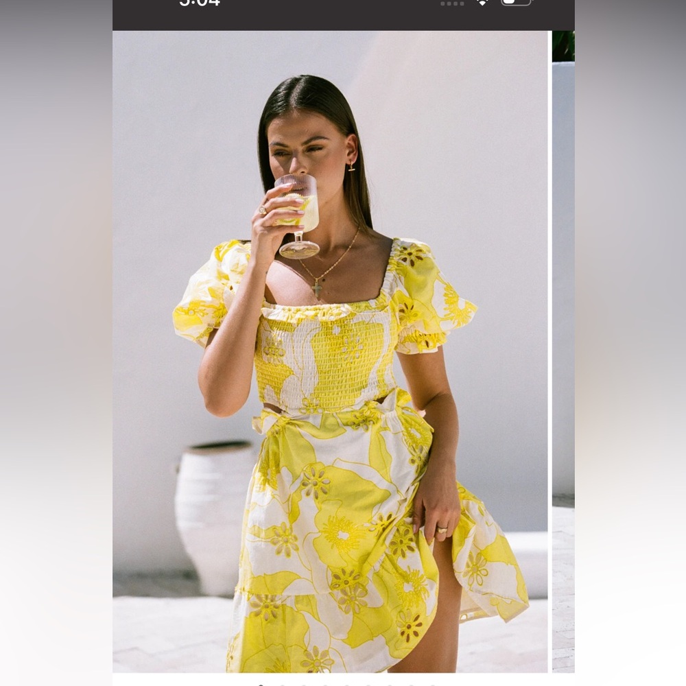 Yellow and white sundress with cutout through sides into back